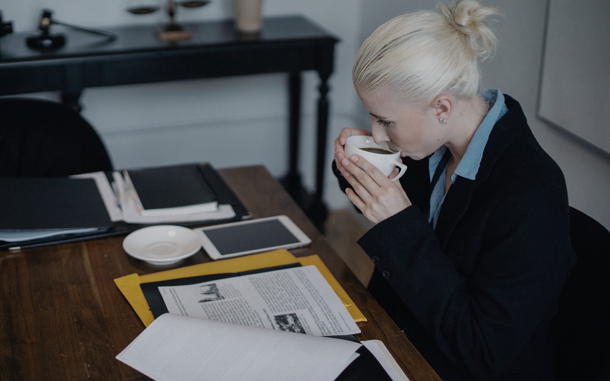 Professional legal adviser working at a desk in a refined office
