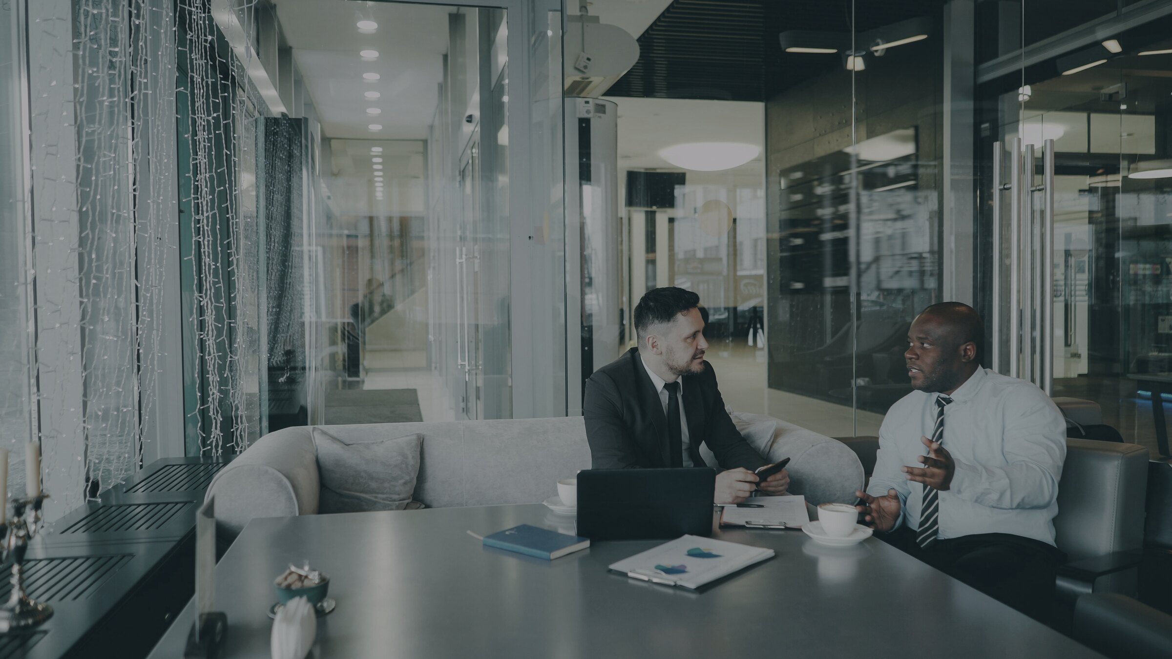 Two legal professionals consulting in a refined Sydney-style office